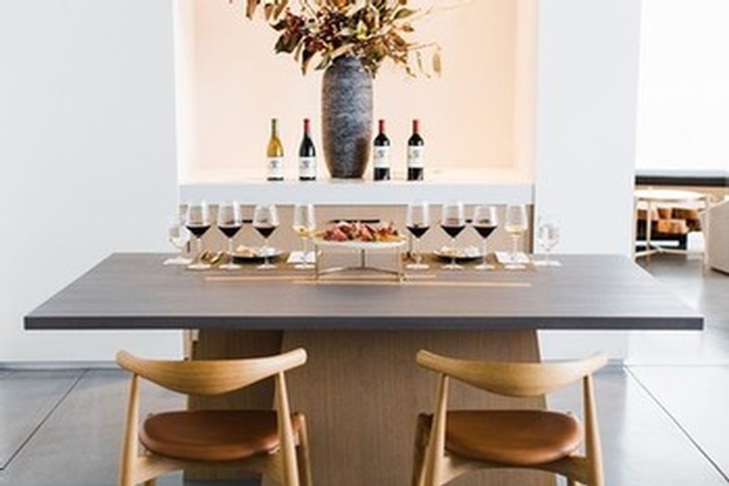 tasting room table with glasses and bottles